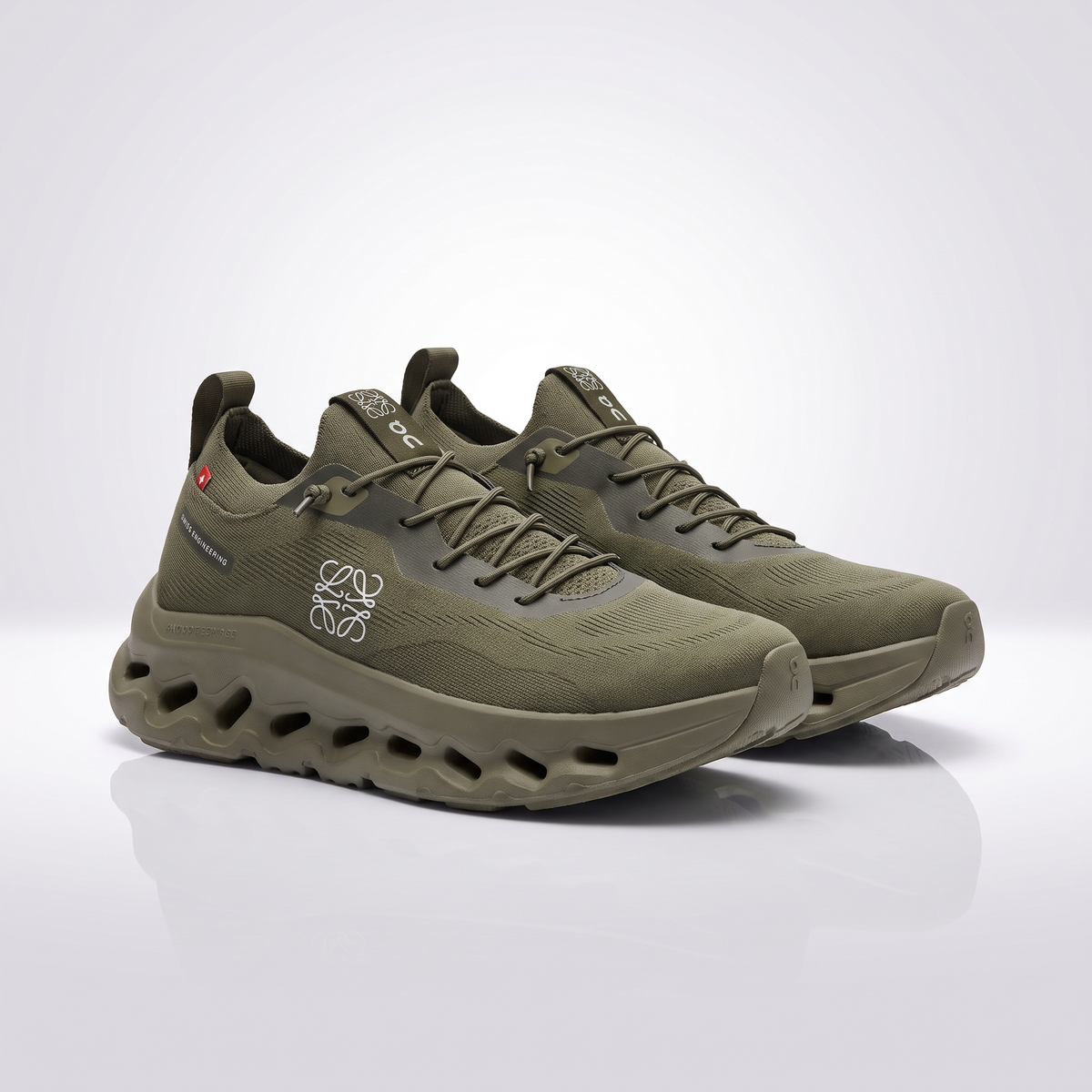 A pair of olive green running shoes with a chunky, sculpted sole featuring circular cutouts, displayed on a clean white reflective studio surface.